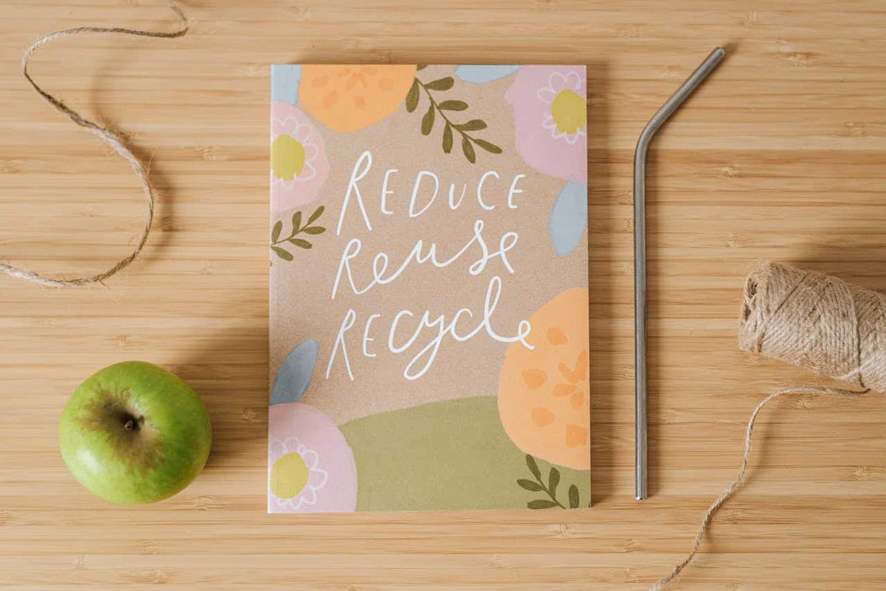 A notebook with a sustainable message on it